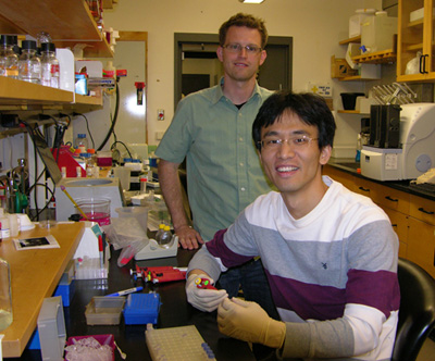 postdoc and student in a lab